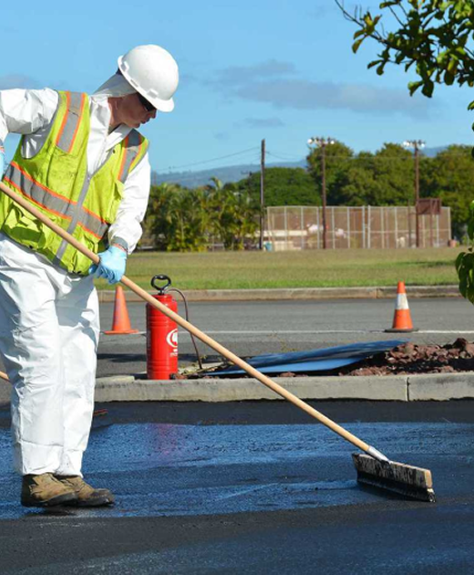 Parking Lots Plus crew applying sealcoating